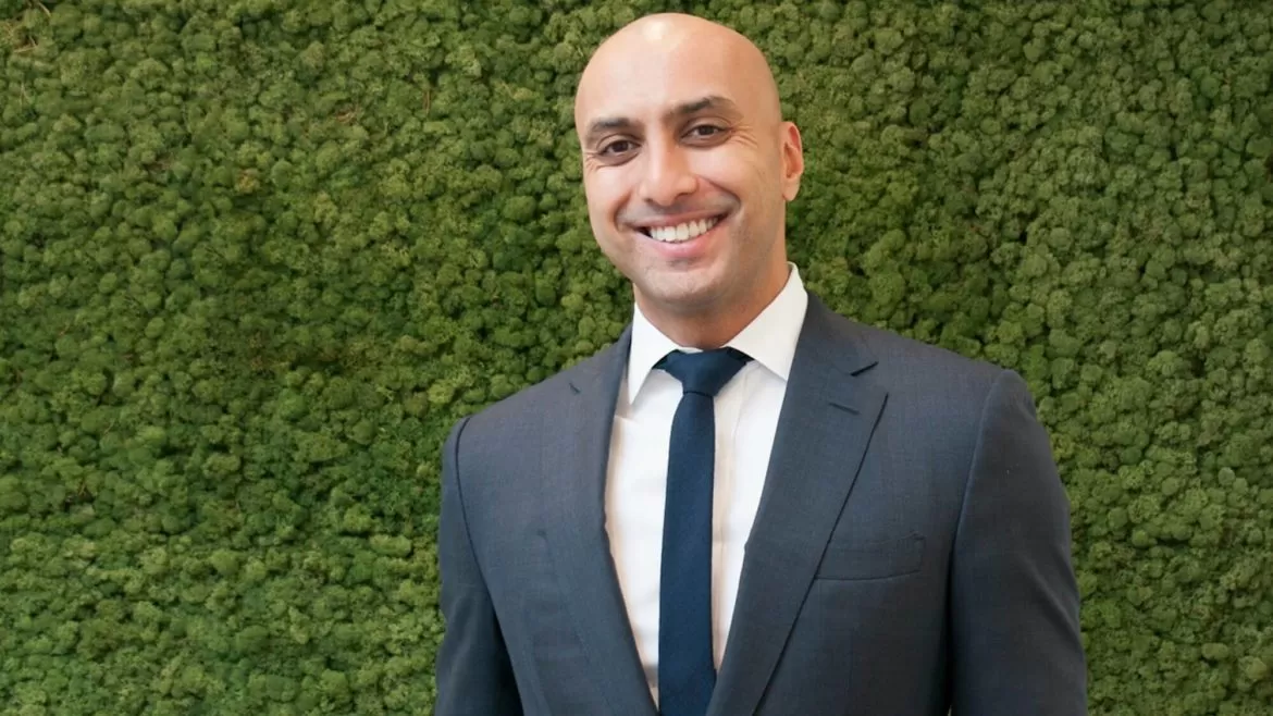 smiling man in black suit and tie